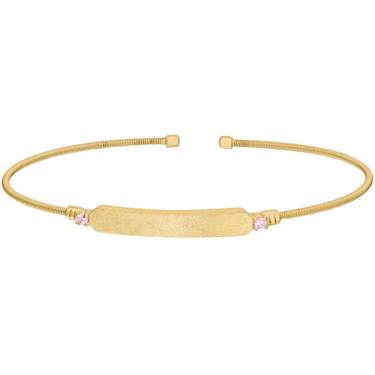 Serene touch bracelets -Gold Finish Sterling Silver Cable Cuff Bracelet with Name Plate and Simulated Pink Sapphire Birth Gems - October