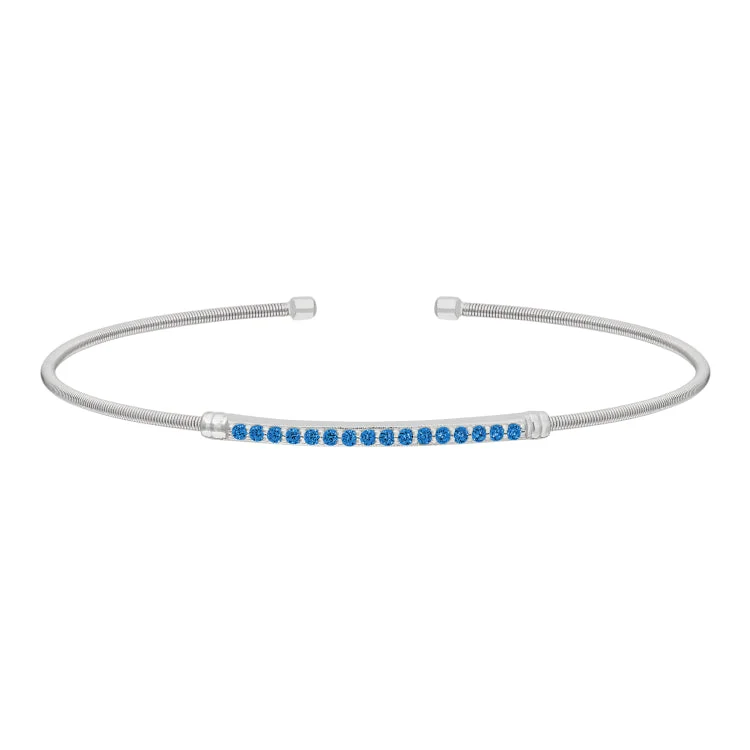 Hushed calm bracelets -Rhodium Finish Sterling Silver Cable Cuff Bracelet with Simulated Blue Zircon Birth Gems - December