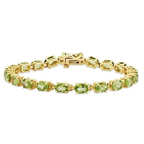 Fanciful twist bracelets -14K YELLOW GOLD 9 CARAT TOTAL WEIGHT PERIDOT BRACELET