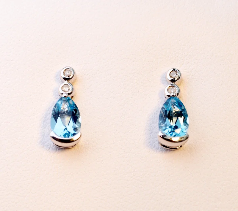 Ladies Earrings with Lock Spark-14K white gold post earrings with pear-shaped Blue Topaz drops