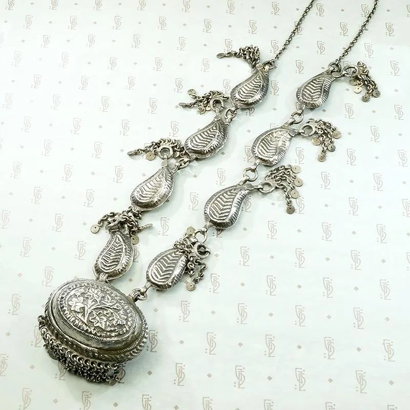 Ladies lunar whisper necklaces -Pradesh Repoussé Silver Paisley Necklace