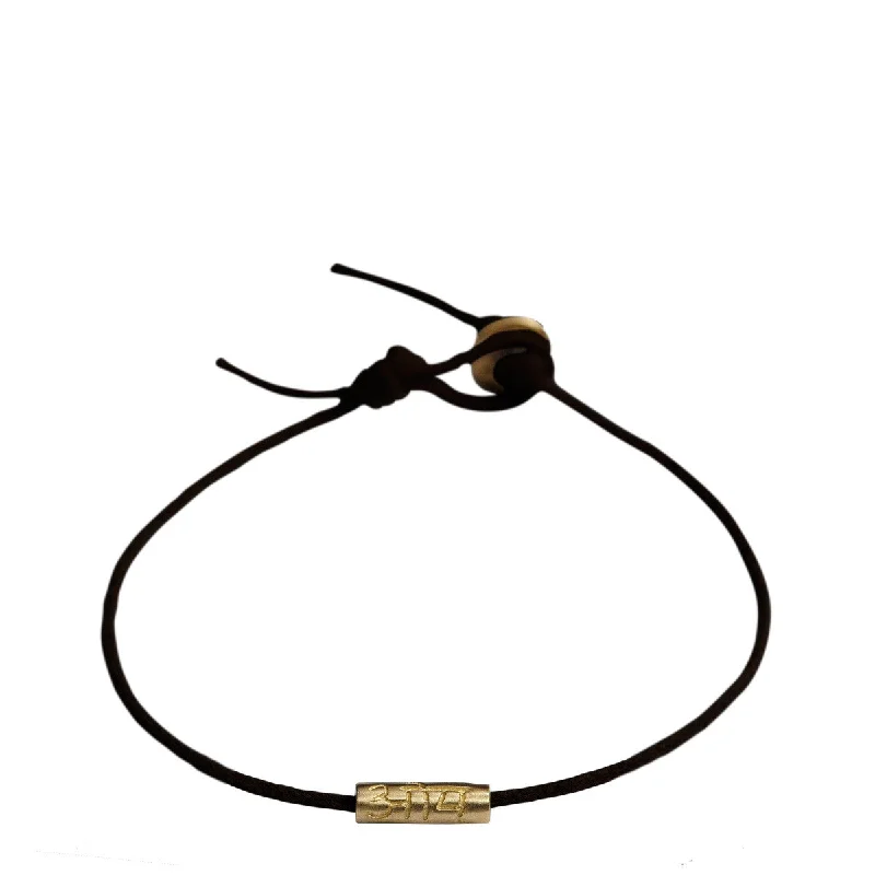 Flowing hippie bracelets -10K Gold Om Tube Bracelet on Black Cord