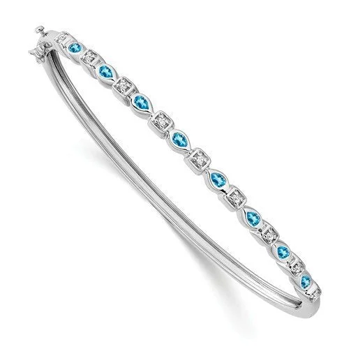 Galactic flare bracelets -14KT WHITE GOLD BLUE TOPAZ AND DIAMOND BANGLE