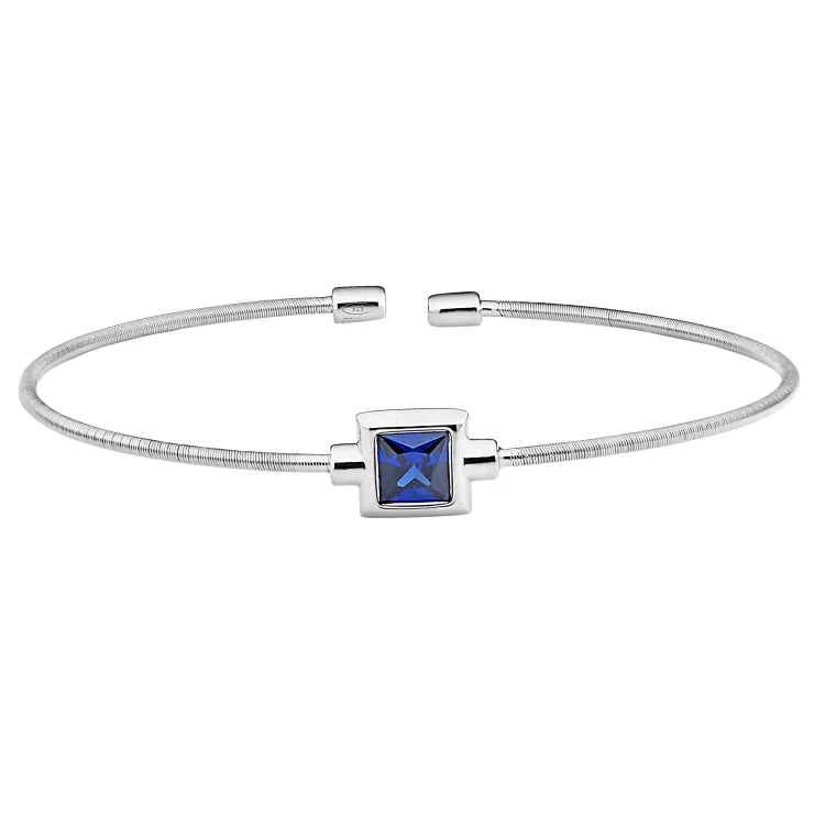 Substantial heavy bracelets -Rhodium Finish Sterling Silver Cable Cuff Bracelet with Princess Cut Simulated Blue Topaz Birth Gem