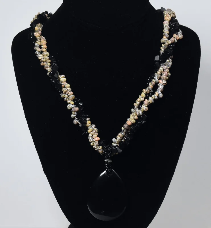 Ladies asymmetrical flair necklaces -Triple Strand Shell and Black Onyx Necklace with Black Onyx Pendant