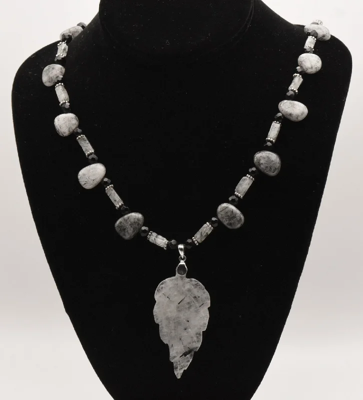 Ladies coin edge necklaces -Black Tourmalinated Quartz Carved Leaf Pendant on Black Tourmalinated Beaded Necklace