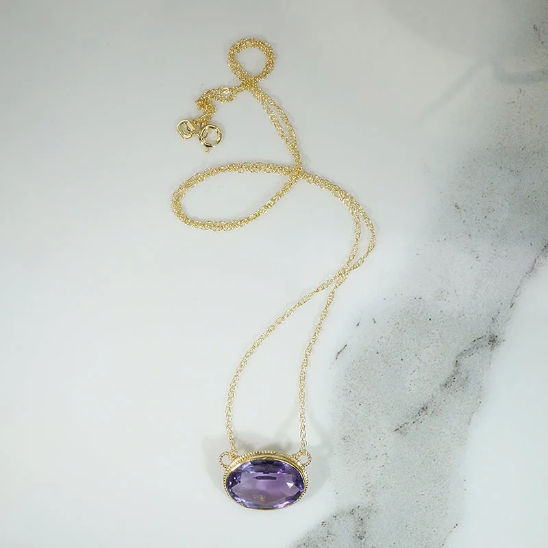 Ladies serene touch necklaces -Vibrant Oval Amethyst in Gold Bezel Necklace